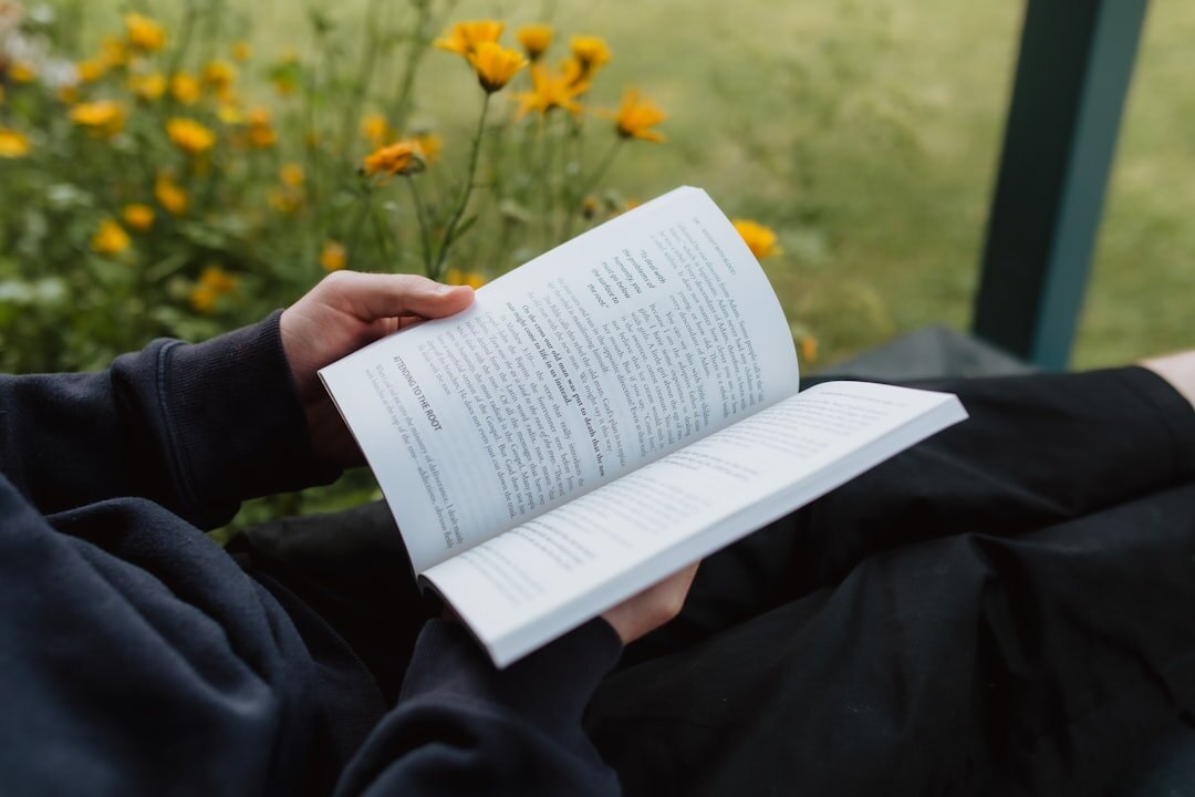 person reading self help book