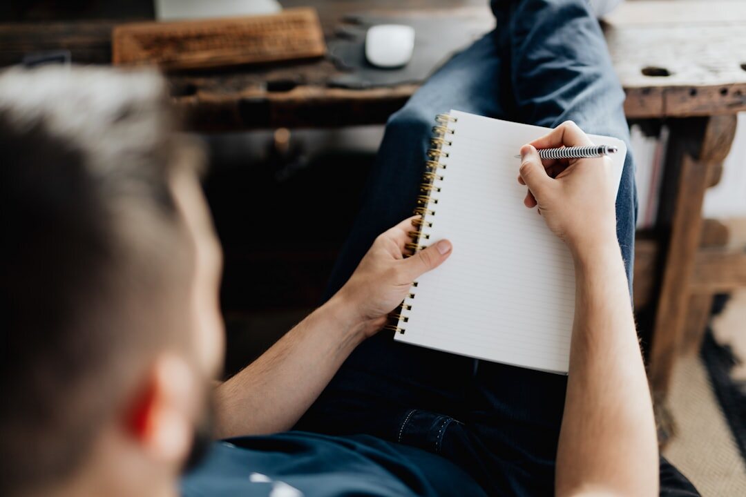 person writing notes for conversation